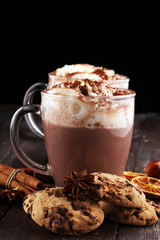 Hot chocolate cocoa with whipped cream on table.