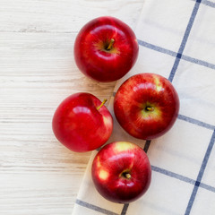 Fresh raw red apples on white wooden surface, top view. Flat lay, from above, overhead.