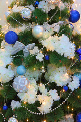 Christmas fir-tree and christmas decorations taken closeup.