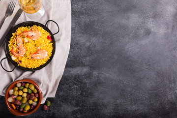 Traditional Spanish paella with seafood. Prepared in traditional pan