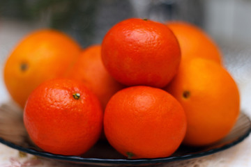  Clémentine and oranges laid on a plate