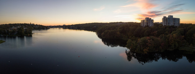 Aerial panoramic view of a Lake Banook in the Modern City during a vibrant Sunset. Taken in Halifax, Dartmouth, Nova Scotia, Canada. - obrazy, fototapety, plakaty