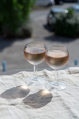 Rose wine of Provence, France, served cold on outdoor terrace in two wine glasses