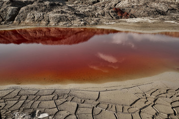 Clay Open Quarry Mars Landscape with Orange Water © glazunoff