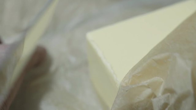 Prepareing toast in a home kitchen. Good quality bread and good quality butter. Cinematic lighting with suttle grading.