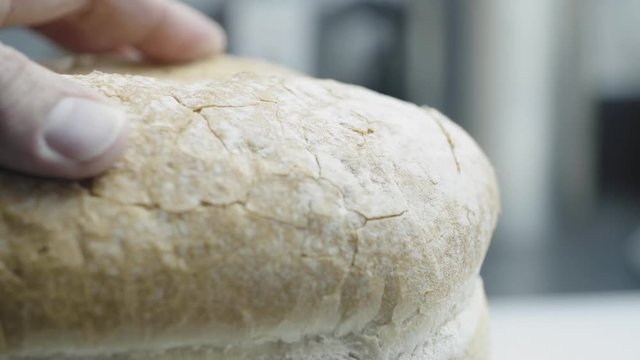 Prepareing toast in a home kitchen. Good quality bread and good quality butter. Cinematic lighting with suttle grading.