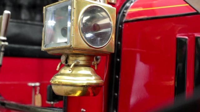 Close up shot of a vintage lantern on an oldtimer bus coach.