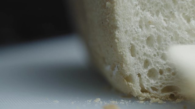 Prepareing toast in a home kitchen. Good quality bread and good quality butter. Cinematic lighting with suttle grading.
