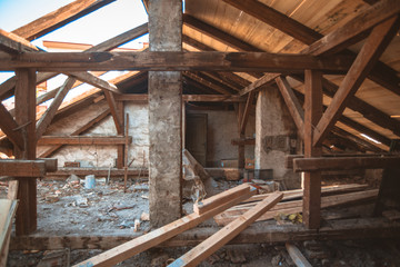 Fototapeta na wymiar Old destroyed rooftop piles bricks and wood preparations for remodeling.