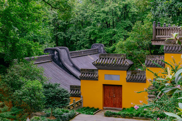 Buildings with yellow wall, red door, and black roof tiles, Lingyin Temple, Hangzhou, China