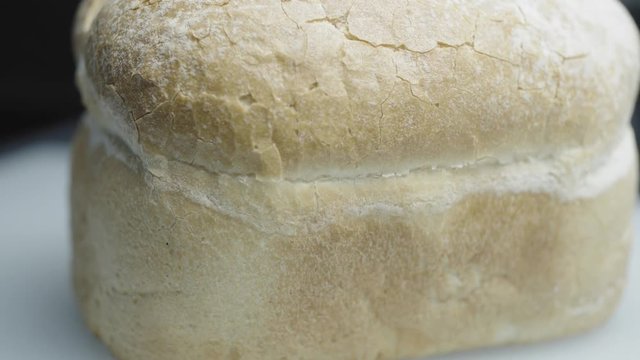 Prepareing toast in a home kitchen. Good quality bread and good quality butter. Cinematic lighting with suttle grading.