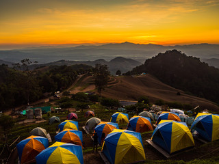 tent in the sunset overlooking mountains