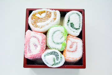 Delicious rolls of Lokum with fruit marmalade in japanese style in black box