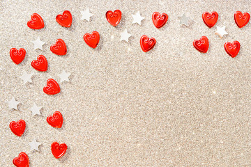 Beautiful holiday greeting card. Shiny silver background with red hearts with silver stars for Valentine's day, for wedding 