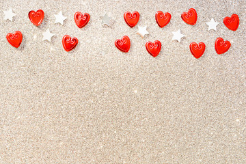 Beautiful holiday greeting card. Shiny silver background with red hearts with silver stars for Valentine's day, for wedding 