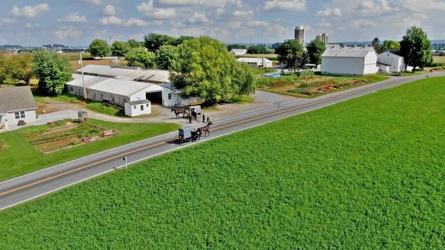 Aerial Drone shot of Amish horse and buggy in New Holland, Pennsylvania.