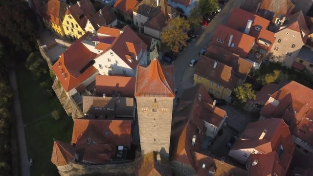 Aerial shot from the medieval town Rothenburg ob der Tauber in Germany, looking down on the town garden and ending up with a view of the beautiful church