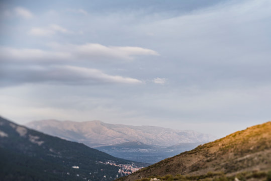 Tranquil remote mountains and valley at sunset