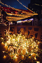Christmas festival light garlands decoration on house porch in city