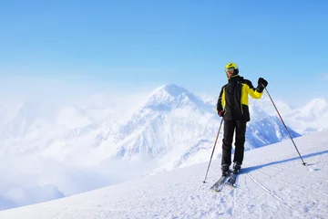 Fotobehang Skier standing on mountain slope © destillat