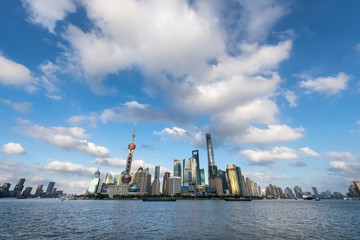 Naklejka premium shanghai skyline against a sunny sky