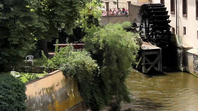 View of the island of Kampa and channel Certovka, also called stream of the devil, and of one of its famous windmills. Prague, Czech Republic