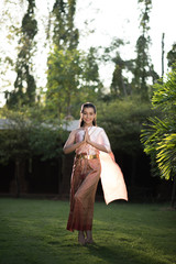 Beautiful Woman wearing typical Thai dress