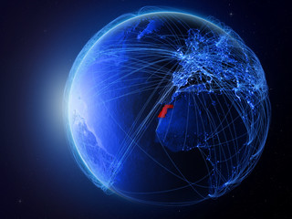 Western Sahara from space on planet Earth with blue digital network representing international communication, technology and travel.