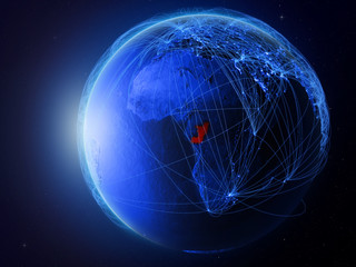 Congo from space on planet Earth with blue digital network representing international communication, technology and travel.