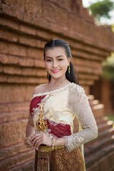 Fototapeta na wymiar Beautiful Woman wearing typical Thai dress