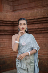 Obraz premium Beautiful Woman wearing typical Thai dress