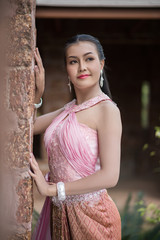 Beautiful Woman wearing typical Thai dress