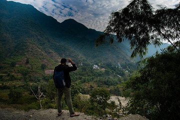 Man by mountains 