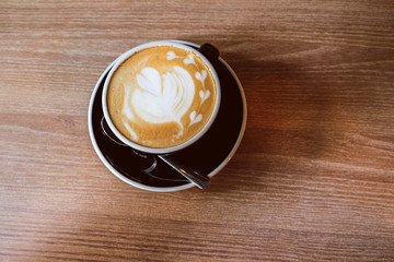 Hot Latte Coffee on wooden floor