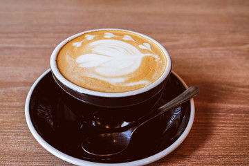 Hot Latte Coffee on wooden floor