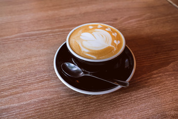 Hot Latte Coffee on wooden floor