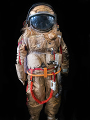 Astronaut or spaceman or cosmonaut on dark background as sci-fi or fantastic explore background for design © DedMityay