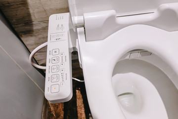 Modern high tech toilet with electronic bidet in Thailand. japan style toilet bowl, high technology sanitary ware. - obrazy, fototapety, plakaty