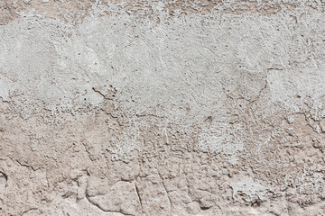 Ancient wall with peeling plaster. Old concrete wall textured background