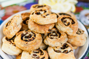 Open round pies lie on plate