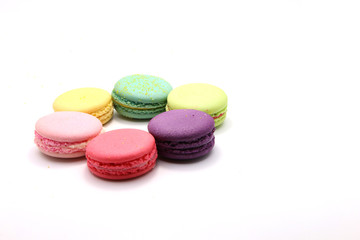 Obraz na płótnie Canvas Cake macaron or macaroon isolated on white background from above, colorful almond cookies, pastel colors, vintage card, front view