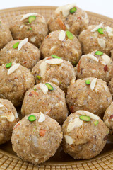 Indian Traditional Sweet Food Urad Dal Laddu Also Know as Laddoo, Ladoo, Laddo are Ball-Shaped Sweets Made of Butter, Dry Fruits, Fenugreek and other Spices. Urad Dal laddu Sweet Mostly Eat in Winter