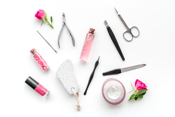 tools for manicure with spa salt and rose on white background top view