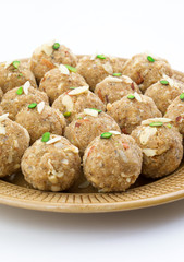 Indian Traditional Sweet Food Urad Dal Laddu Also Know as Laddoo, Ladoo, Laddo are Ball-Shaped Sweets Made of Butter, Dry Fruits, Fenugreek and other Spices. Urad Dal laddu Sweet Mostly Eat in Winter