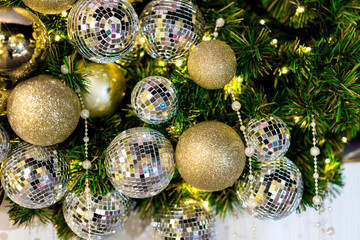Blurred Christmas trees and gold balls for decorate background