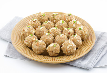 Indian Traditional Sweet Food Urad Dal Laddu Also Know as Laddoo, Ladoo, Laddo are Ball-Shaped Sweets Made of Butter, Dry Fruits, Fenugreek and other Spices. Urad Dal laddu Sweet Mostly Eat in Winter