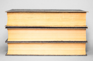 Books on a gray background. Close