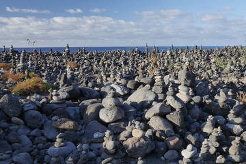 Fototapeta na wymiar A field of balancing rock and pebbles. Puerto de la Cruz, Tenerife, Spain.
