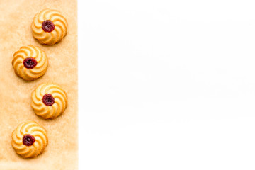 Cook homemade cookies. Pattern with fresh cookies on baking paper on white background top view space for text
