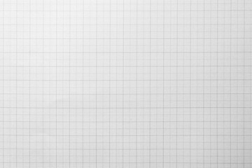 White paper with grid line pattern for background. Close-up.